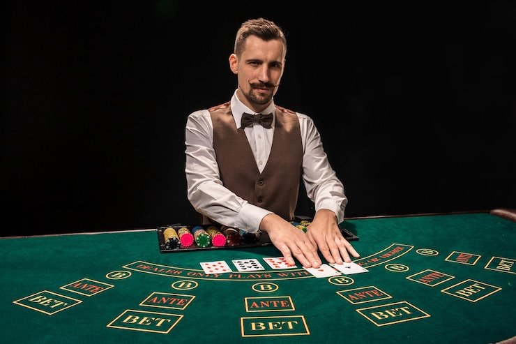 Big Time Gaming table displayed on a mobile phone screen with betting buttons and live dealer video